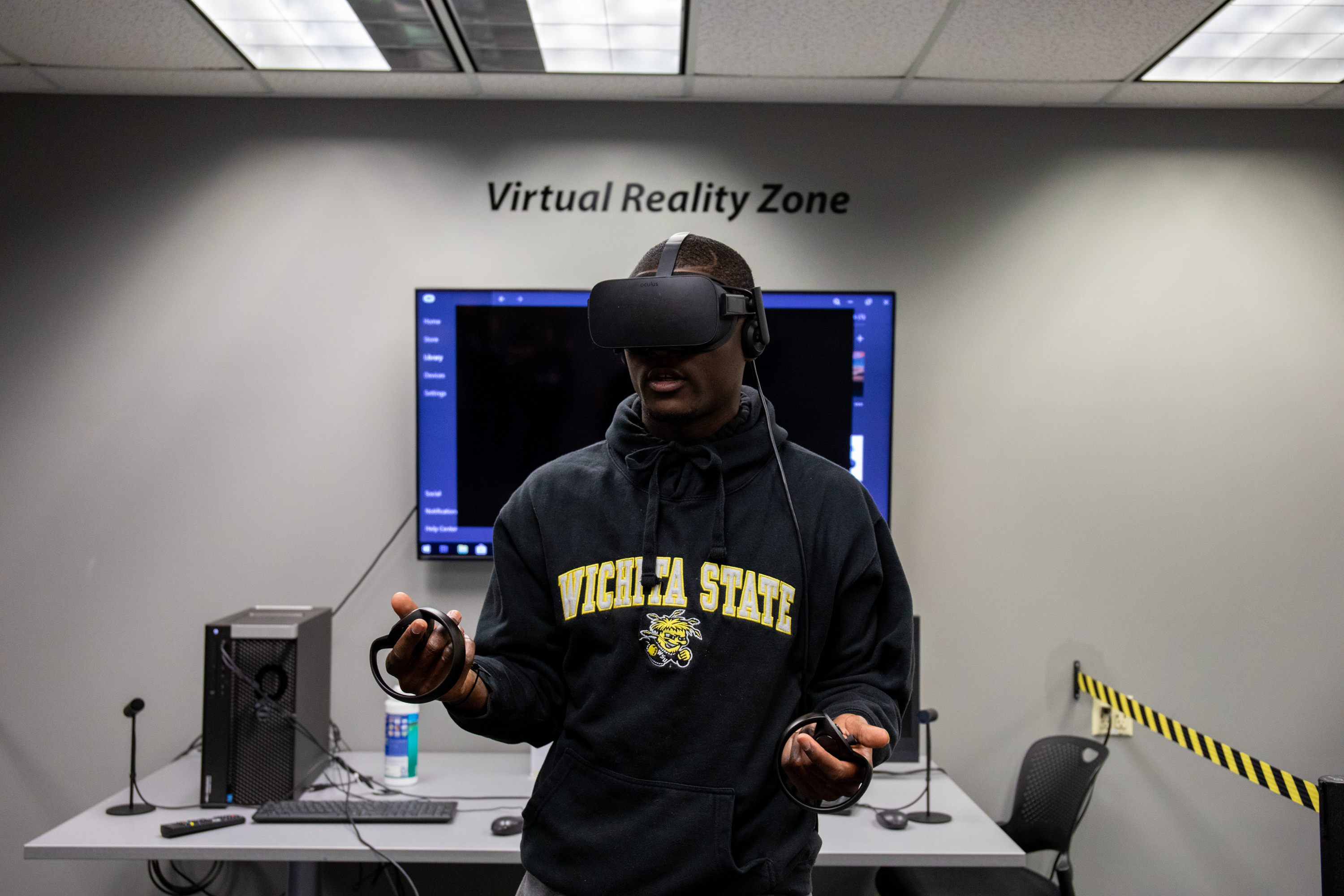 student using a virtual reality set in C-Space