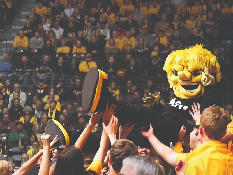 Wu crowd surfing at basketball game