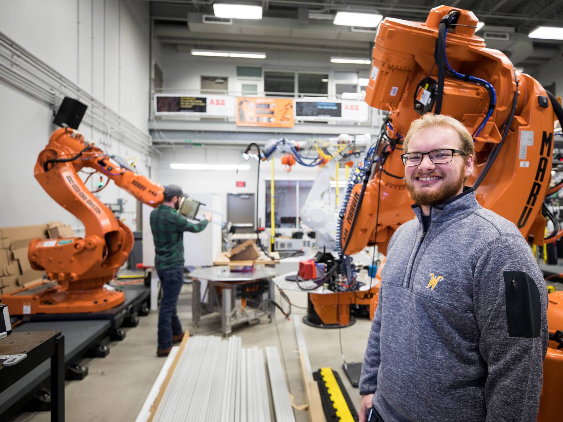 Male engineering student in the robotics lab.