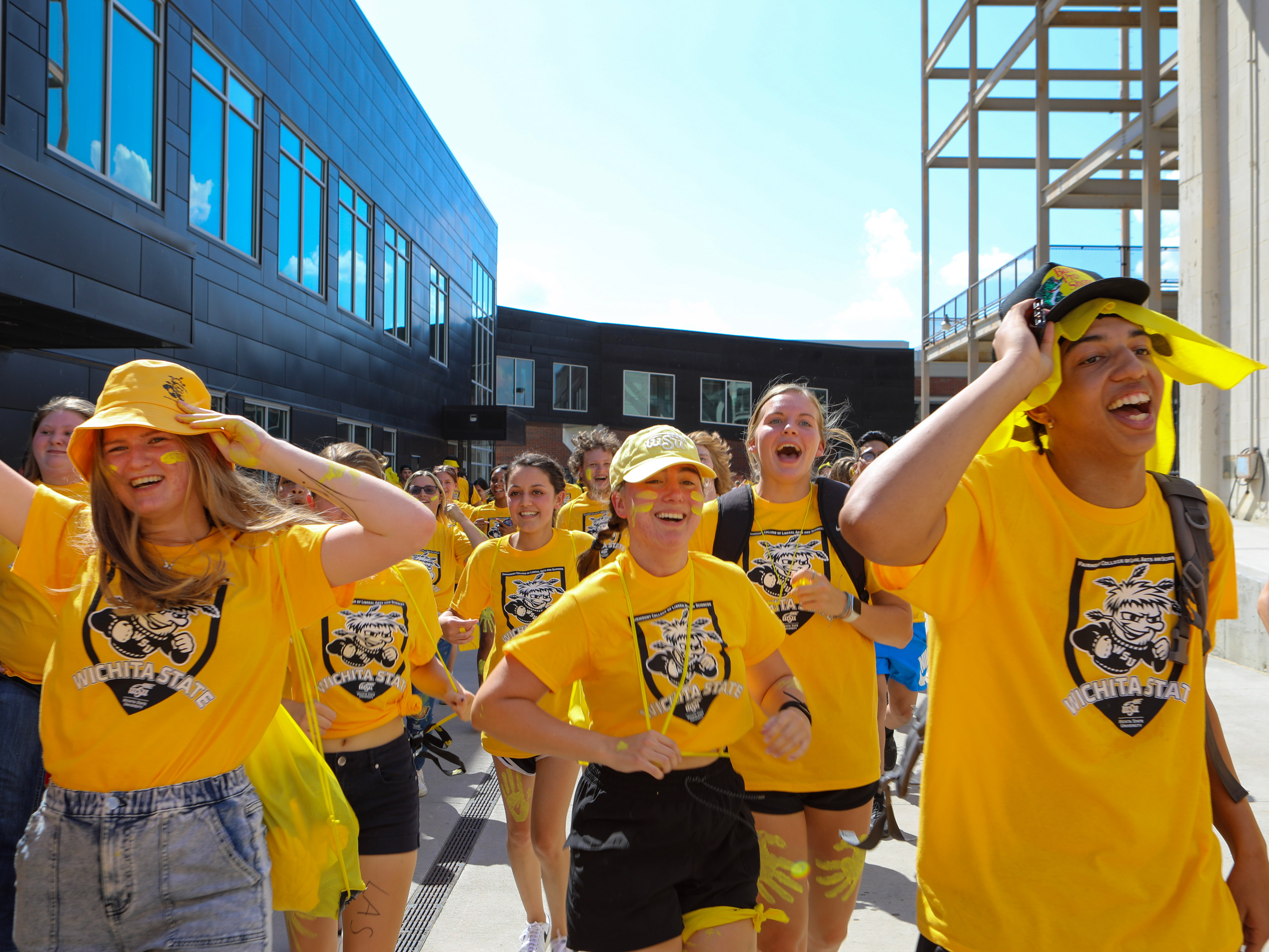 2022 Clash of Colleges students running into the stadium