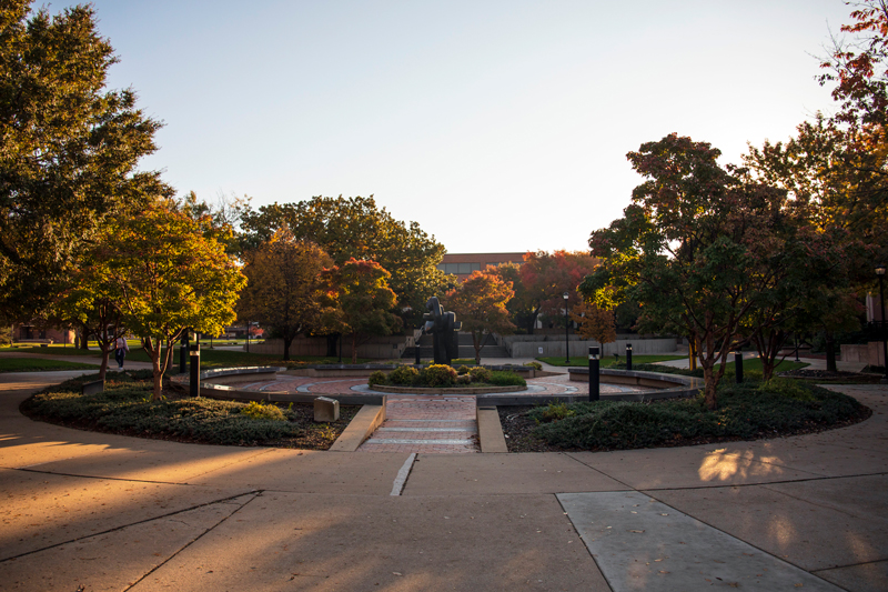 Photo of the circular plaza center with the library in the background.