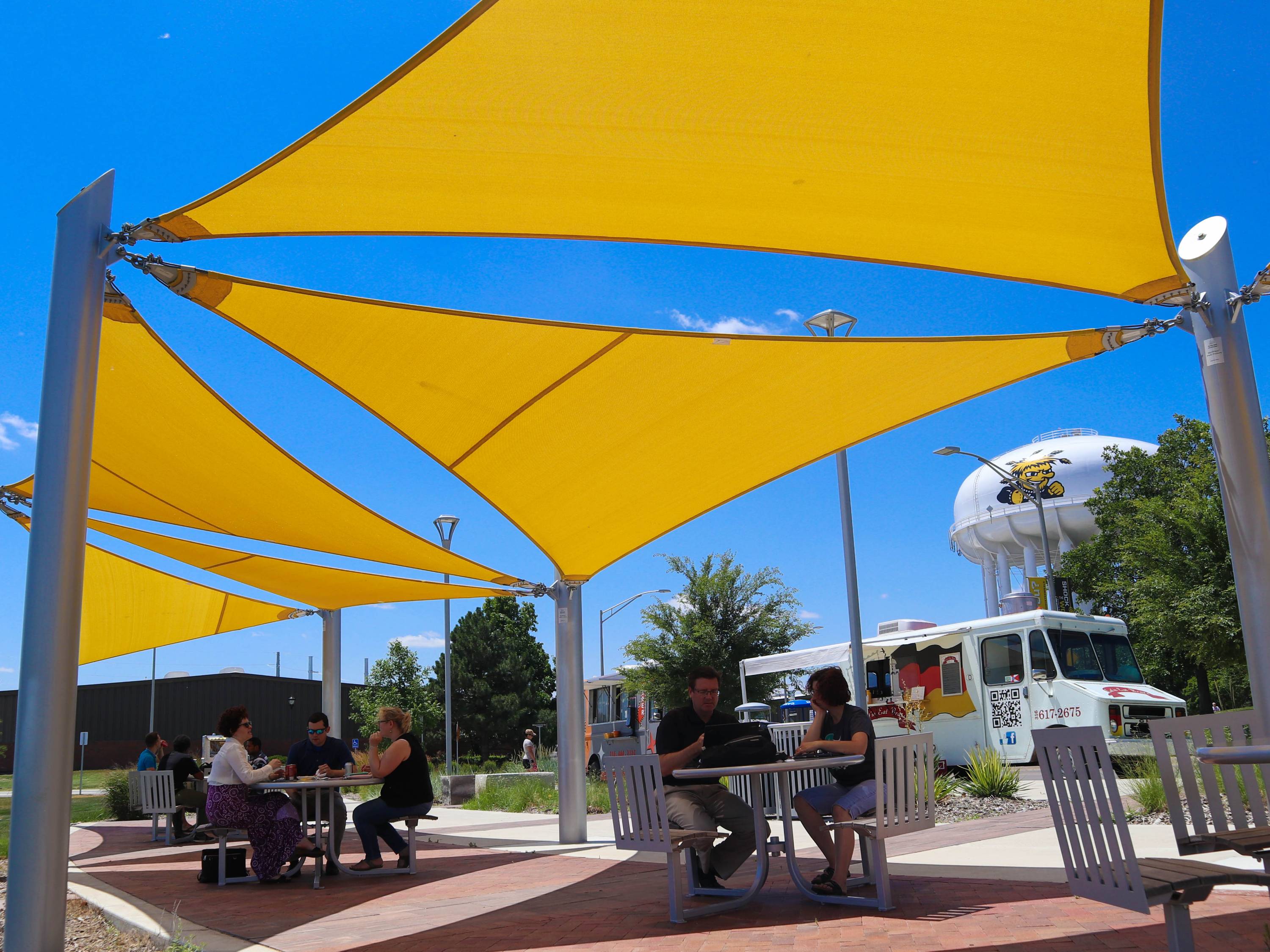 Students, faculty and staff enjoying lunch at the Food Truck Plaza