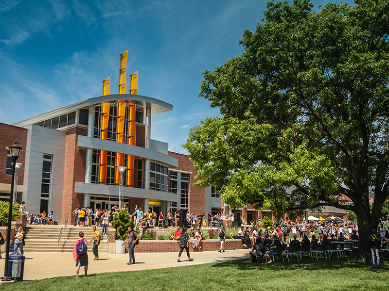 Students walk by the east side of the Rhatigan Student Center