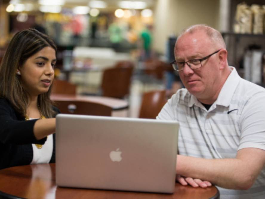 People working on a laptop