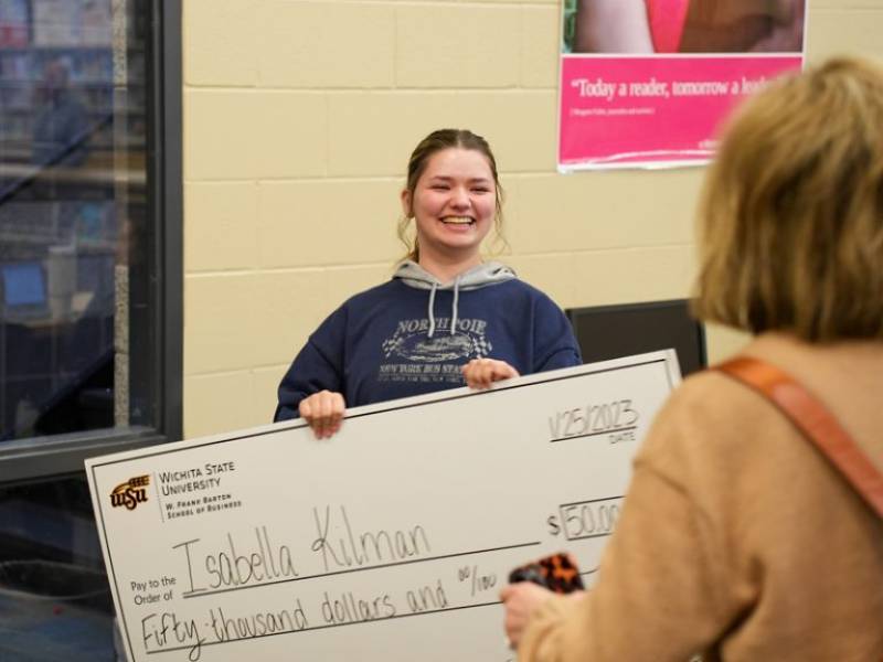 Bella Kilman with giant check