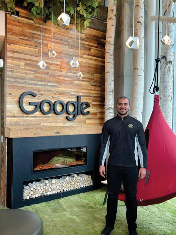 Student in front of Google sign