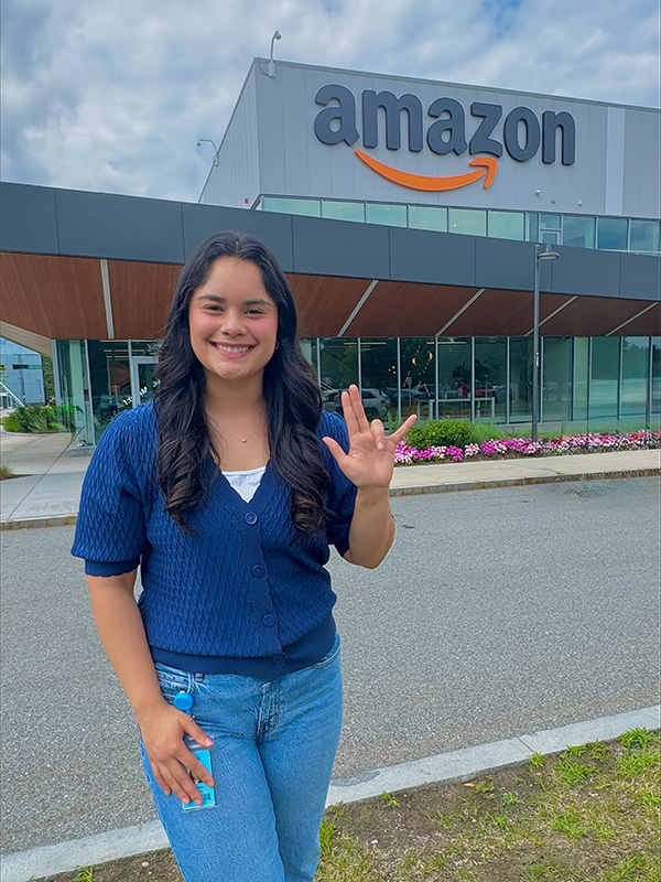 Student in front of Amazon sign