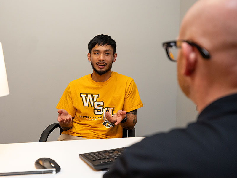 A student works with an advisor