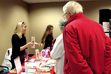 Kate Hietapelto, left, participates in a health fair to inform people about blood cancers.