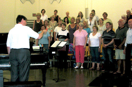 Tom Wine, director of choral activities at Wichita State University, leads a rehearsal of the WSU Summer Choir.
