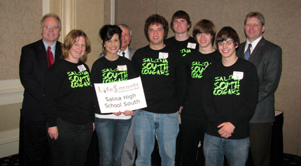 From left: Kevin Glendening, Deputy Bank Commissioner in charge of the Division of Consumer and Mortgage Lending; Susan Montoy; Rachel Groene; Jim Graham; Bret Higgins; Kolten Schulze; Frank Thompson; Thomas Burke; and Scott Oberkrom, chairman of the board of the KCEE and a representative of American Century Investments.