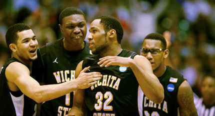 Players congratulate Tekele Cotton (No. 32) after a breakaway dunk in Thursday's 73-55 victory over Pittsburgh in the NCAA Tournament second round.