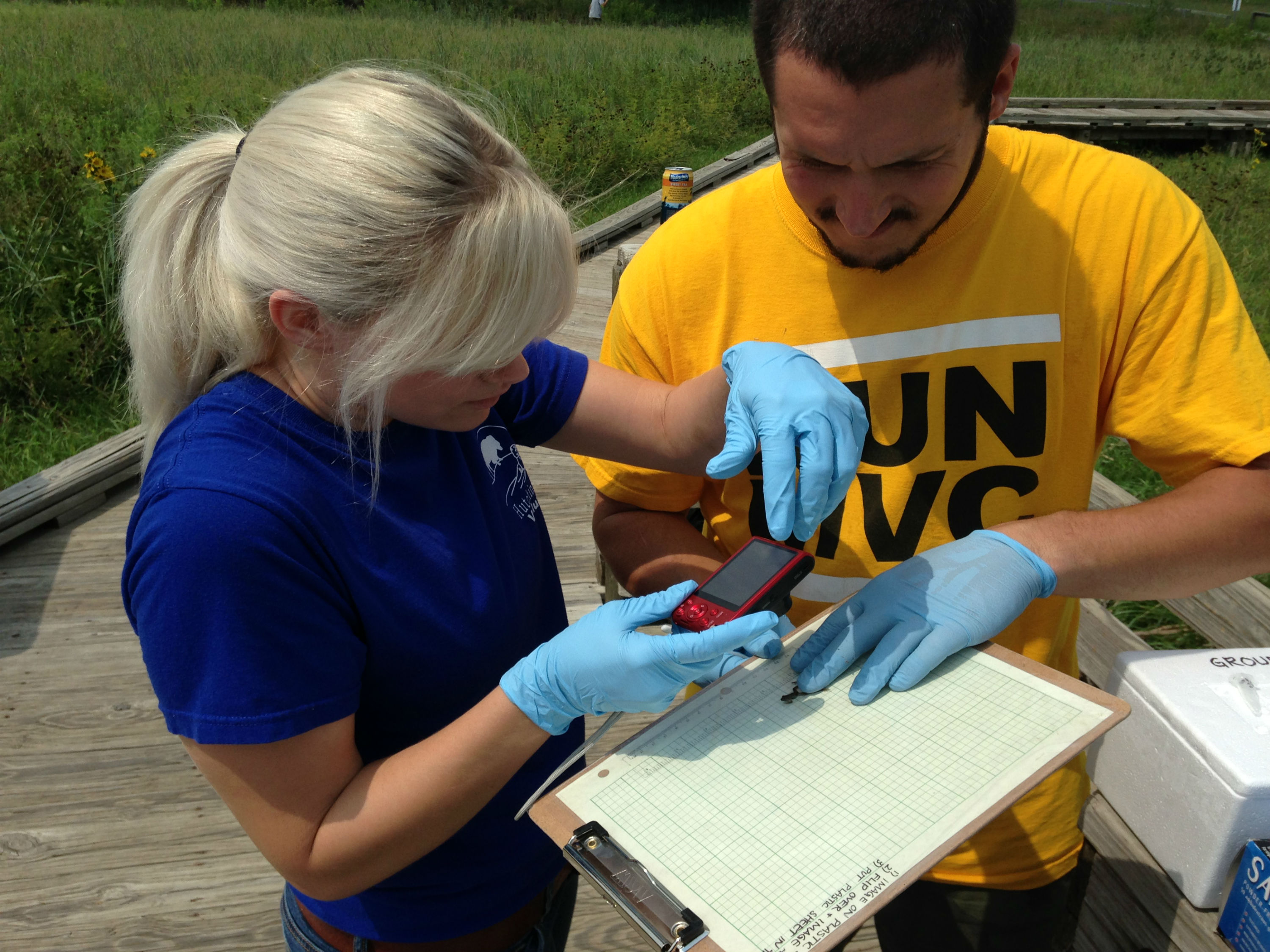 Audrey McTaggart, a WSU volunteer and McPherson College student, and Oliver Keller, WSU graduate student.