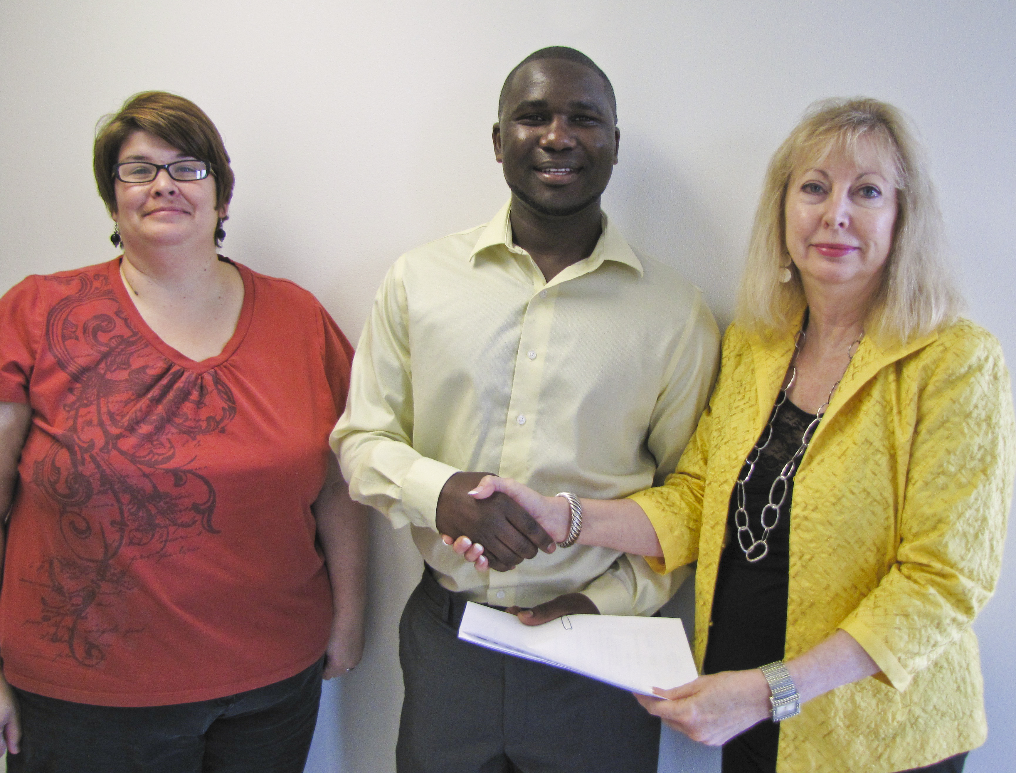 Amy McClintock, left, student Vincent Mogoi and Alicia Huckstadt.