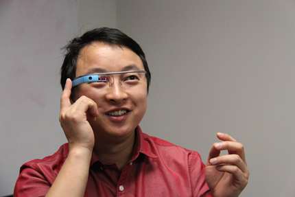 WSU assistant professor Jibo He tests Google Glass as part of his research on driver distraction.