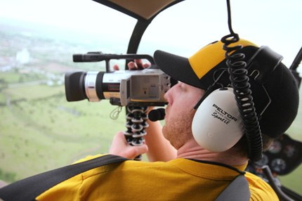 WSU graduate Ian Crane shoots video footage from a helicopter above Greensburg, Kan.