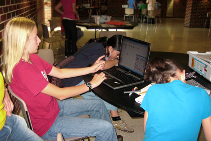 A group of campers the the Wichita State University's LEGO Robotics engineering camp explain how they program their robot's motors.
