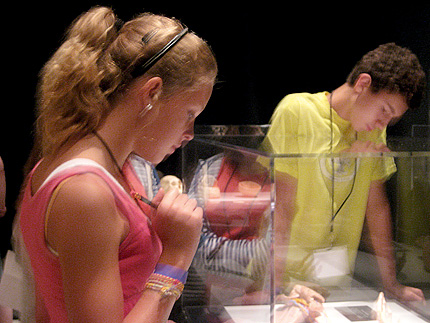 Allison Bauer and Joshua Whitman, high school students participating in WSU's bioengineering camp, study the human body at the exhibit 