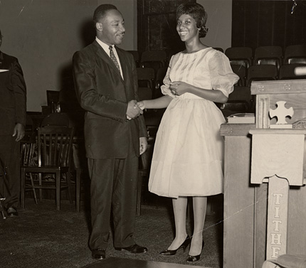 Gwendolyn Mukes shakes hands with Martin Luther King, Jr. Mukes was the president of the NAACP youth council in Oklahoma City in 1958 and played a role in the first nationally recognized student-led sit-in for civil rights.