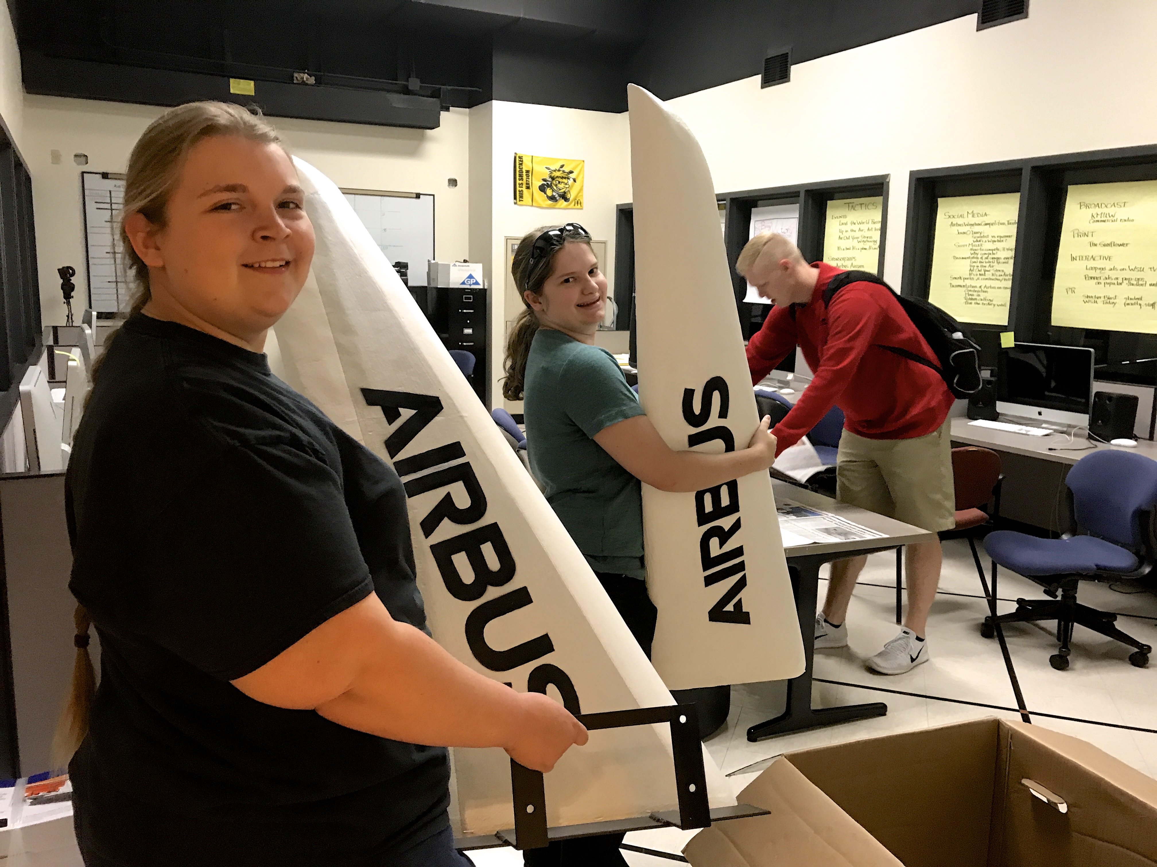 Theatre Technology students Stephanie Crump and Mary White built the wings for the Airbus AirCart, and Jett Reese, a communication major in the Elliott School of Communication, is the Airbus account manager in the student-run ad agency in the Elliott School.