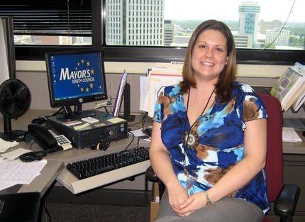 Linsey Sipult sits at her desk on the 13th floor of Wichitaâ€™s City Hall building. She is participating in a year-long fellowship in the city managerâ€™s office.