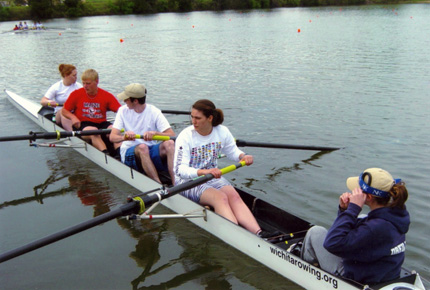 Sydney Fish (front) rows for WSU Crew at Wichita State University.