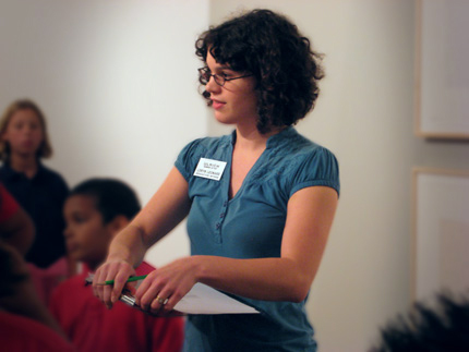 Loryn Leonard guides a tour group of young students through an abstract art exhibit at the Ulrich Museum of Art.