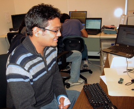 Wajid Hassan works on a project in the WiNeS Lab at WSU's engineering research facility.