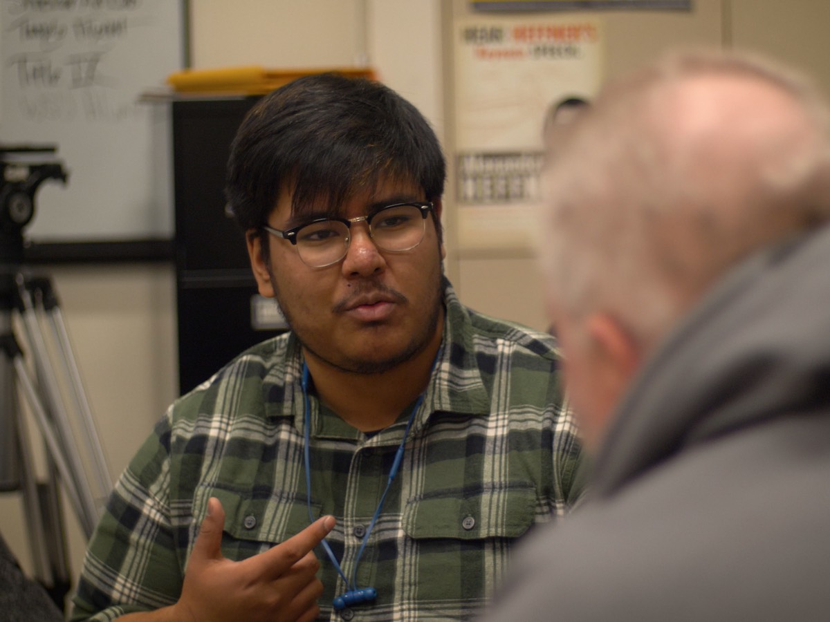 Shocker Ad Lab graphic designer Joshua Perez talks with League 42 founder Bob Lutz.