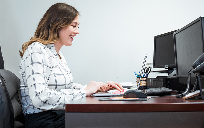Abby White works at her desk