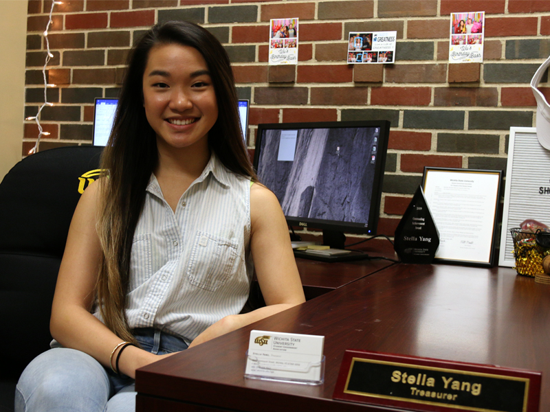 Stella Yang sits at her desk in the Student Government Association office, RSC 219