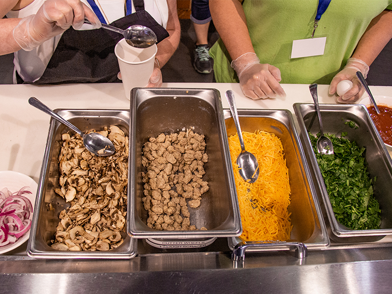 Students choose toppings for their easy-to-make omelet in a cup. Students choose toppings for their easy-to-make omelet in a cup.