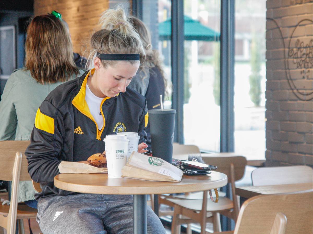 WSU student enjoys coffee at the Braeburn Square Starbucks