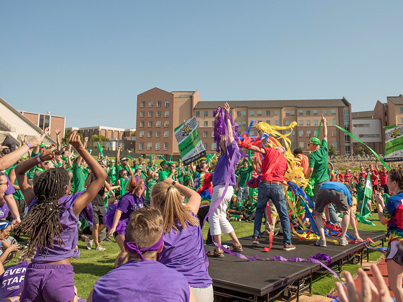 Students cheer on the deans at clash of the colleges