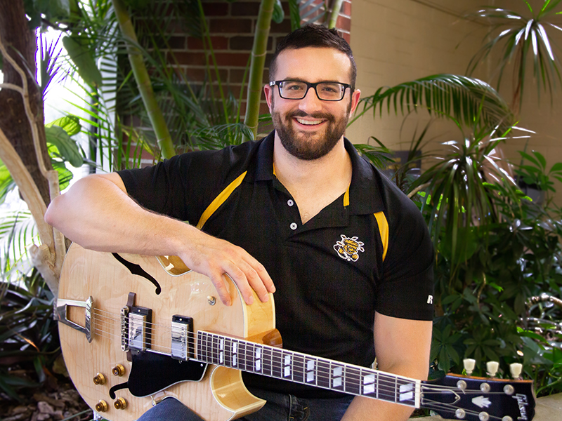 William Flynn with his guitar