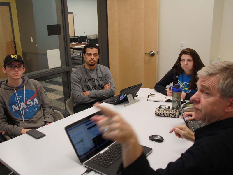 Wichita State Honors College students meet with professor Martin Ratcliffe.