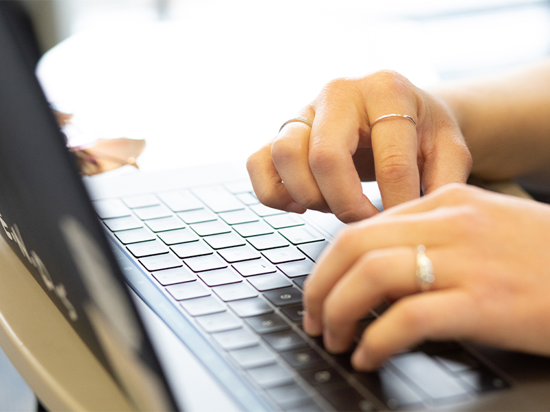 Hands typing on keyboard