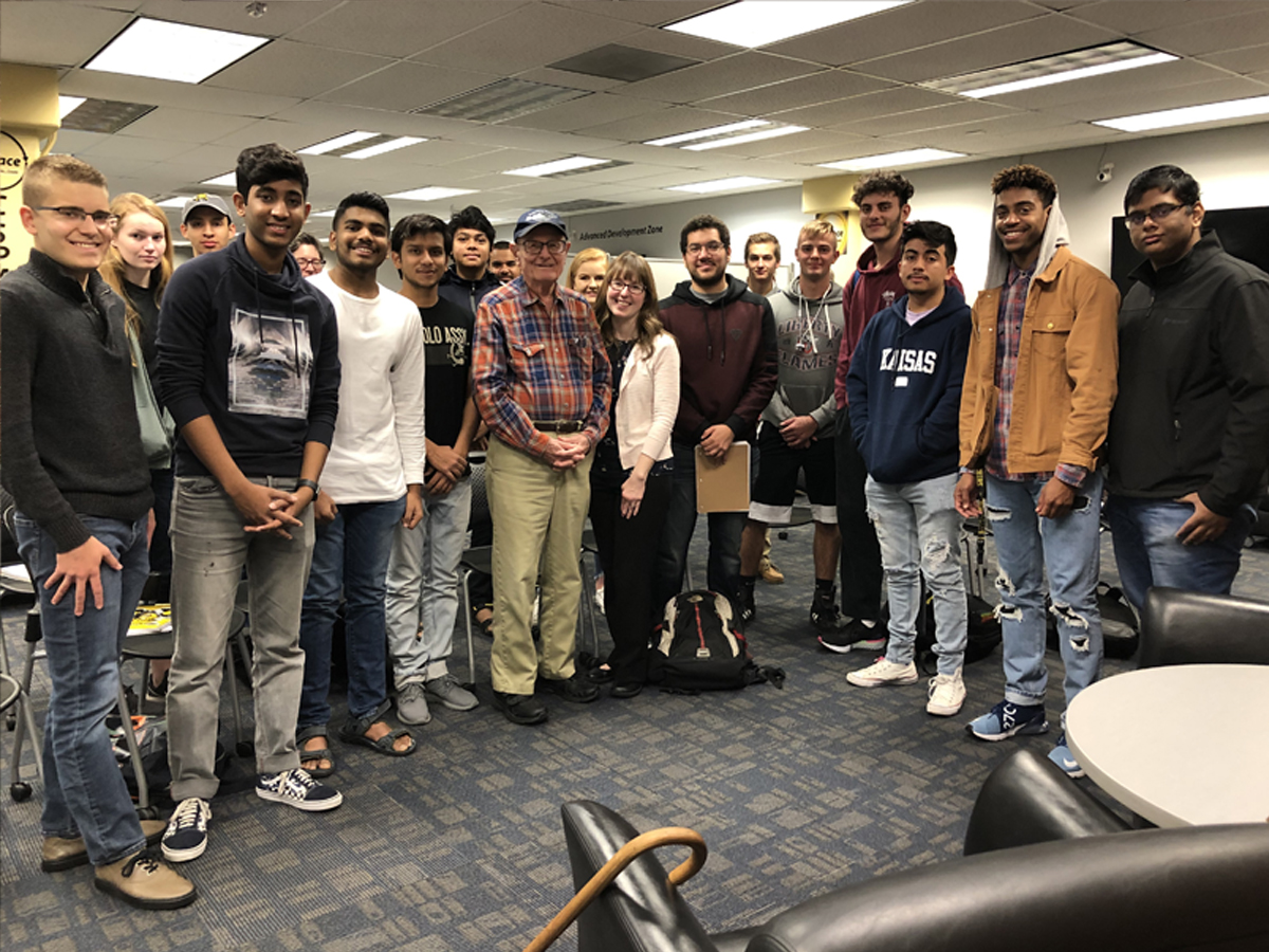 Students, faculty and staff stand with Richard Martin in a group picture in the Ablah Library C-Space