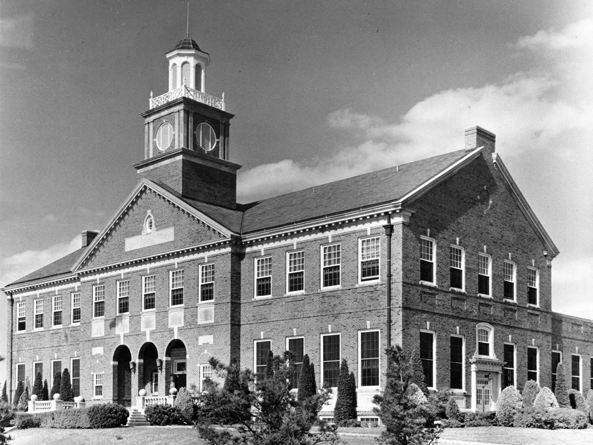 A photo of Morrison Hall in the 1940s, looking northeast. Note the new trees and numerous shrubs around the base of the building.