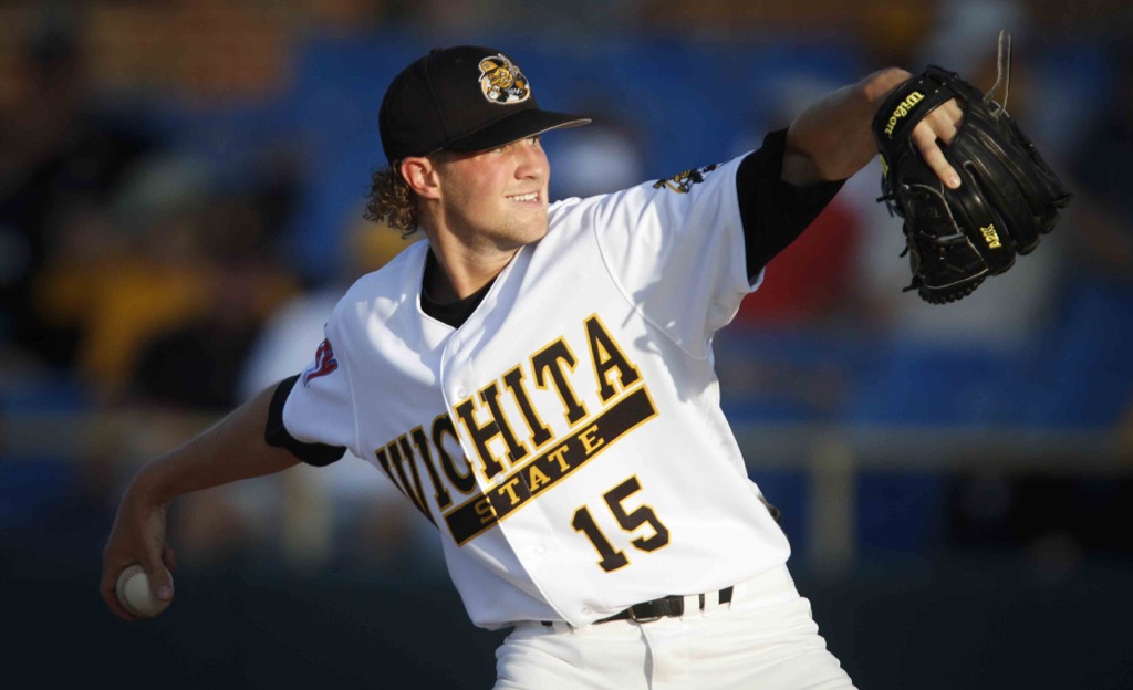 A Shocker baseball player prepares to pitch the ball