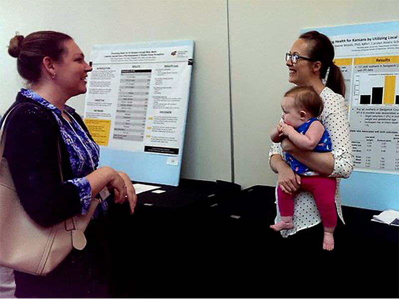 Dr. Nikki Keen Woods (right) at a conference in 2019.