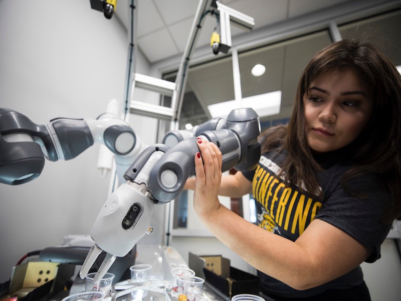 Engineering student working on machinery