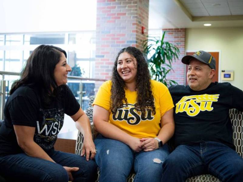 Student and parents on campus