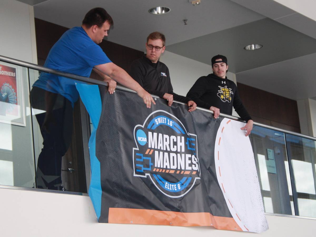 Wichita State students help with NCAA Basketball Tournament preparations at Intrust Bank Arena. Students work in several areas during the set-up, practices and games.