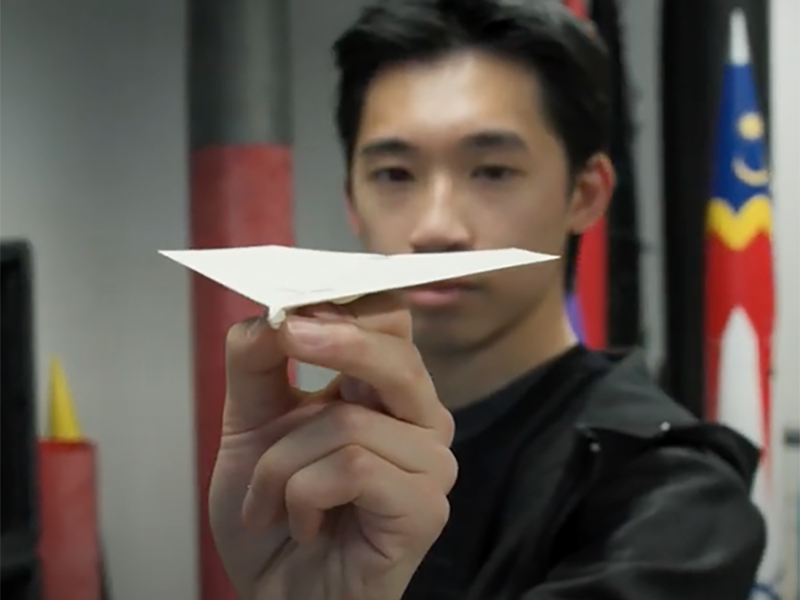 Shocker Julian Chee throws a paper airplane. 