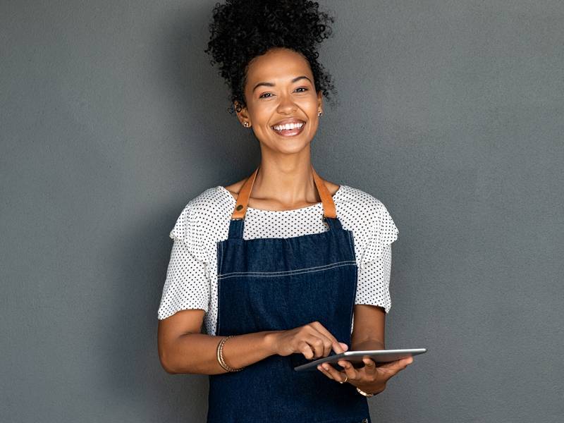 Woman standing with tablet