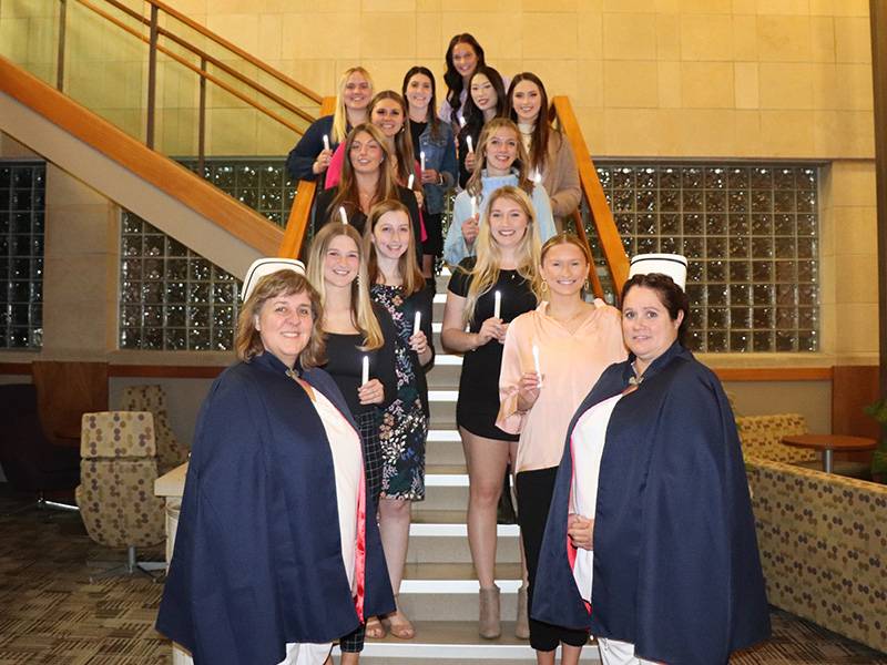 WSU nursing students celebrating Nightingale Ceremony on K-State campus