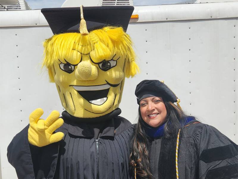 Sara Mata poses with Wu at commencement