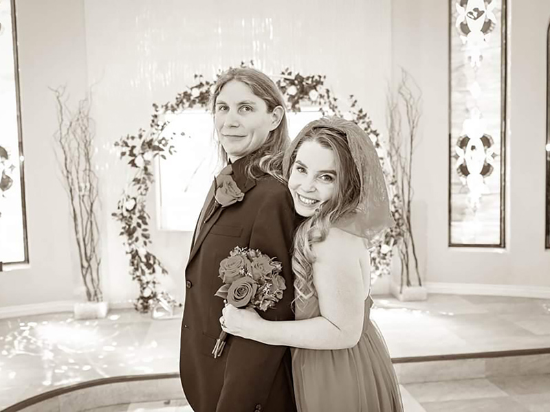 Jaymes Squires poses with his wife