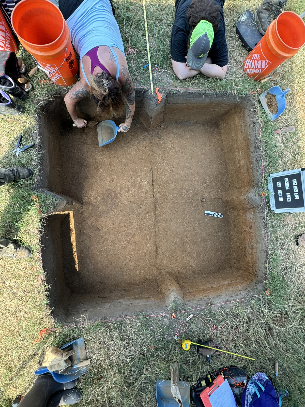 Overhead view of students working on an archeological dig. 